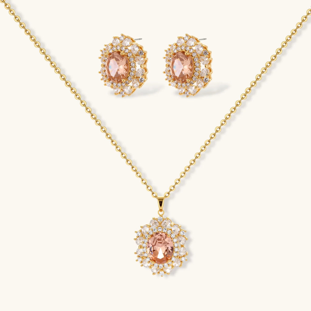 Ornate gold-plated jewelry set featuring peach center stone surrounded by clear AAA cubic zirconia crystals