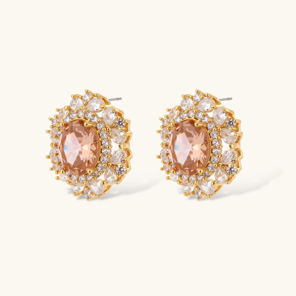 Ornate gold-plated jewelry set featuring peach center stone surrounded by clear AAA cubic zirconia crystals