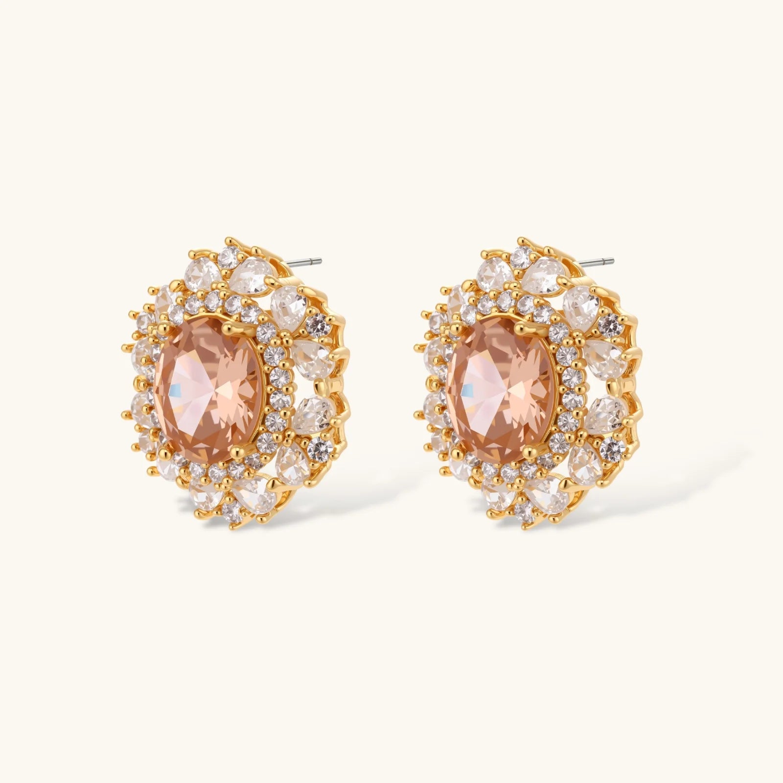Ornate gold-plated jewelry set featuring peach center stone surrounded by clear AAA cubic zirconia crystals