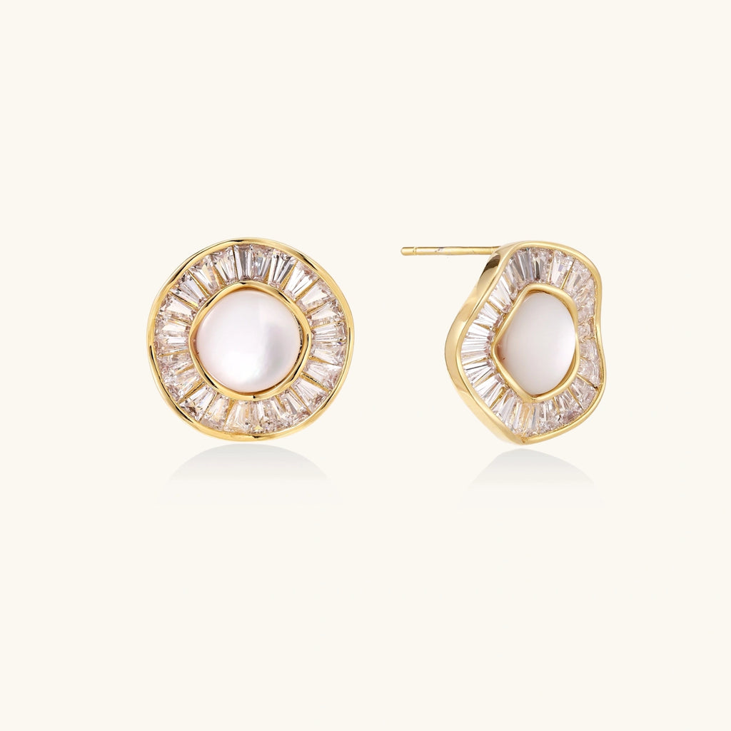 Gold-plated stud earrings with central freshwater pearl surrounded by radiating baguette crystals in sunburst design