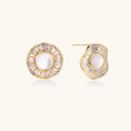 Gold-plated stud earrings with central freshwater pearl surrounded by radiating baguette crystals in sunburst design