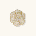 Elegant cream-colored rose brooch with gold plating, zirconia stones, and pearl-like border details on neutral background.