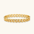 Gold 18K plated stainless steel bangle with continuous open heart links, high-polish finish, on white background.
